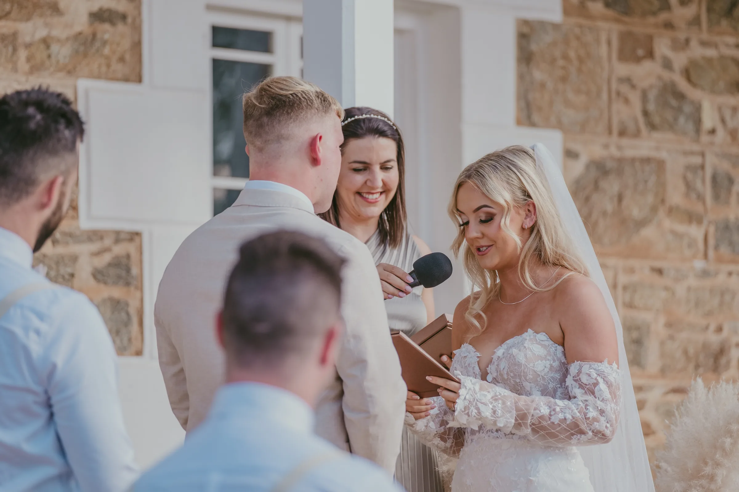 Candid moment of guests laughing with Grace and Lachie moments after their ceremony at Buckland Estate