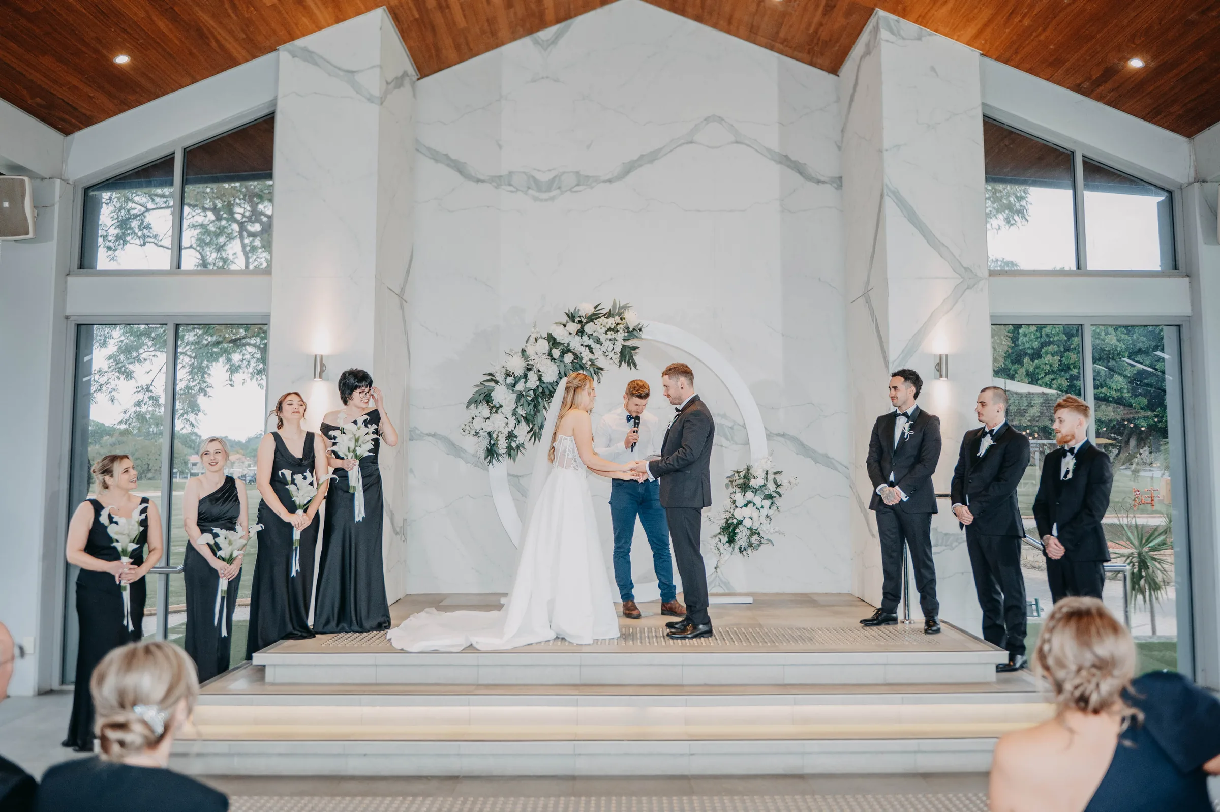 Wide shot of Kirra and Mitch's wedding party arriving at the Garden Pavilion, The Vines Resort