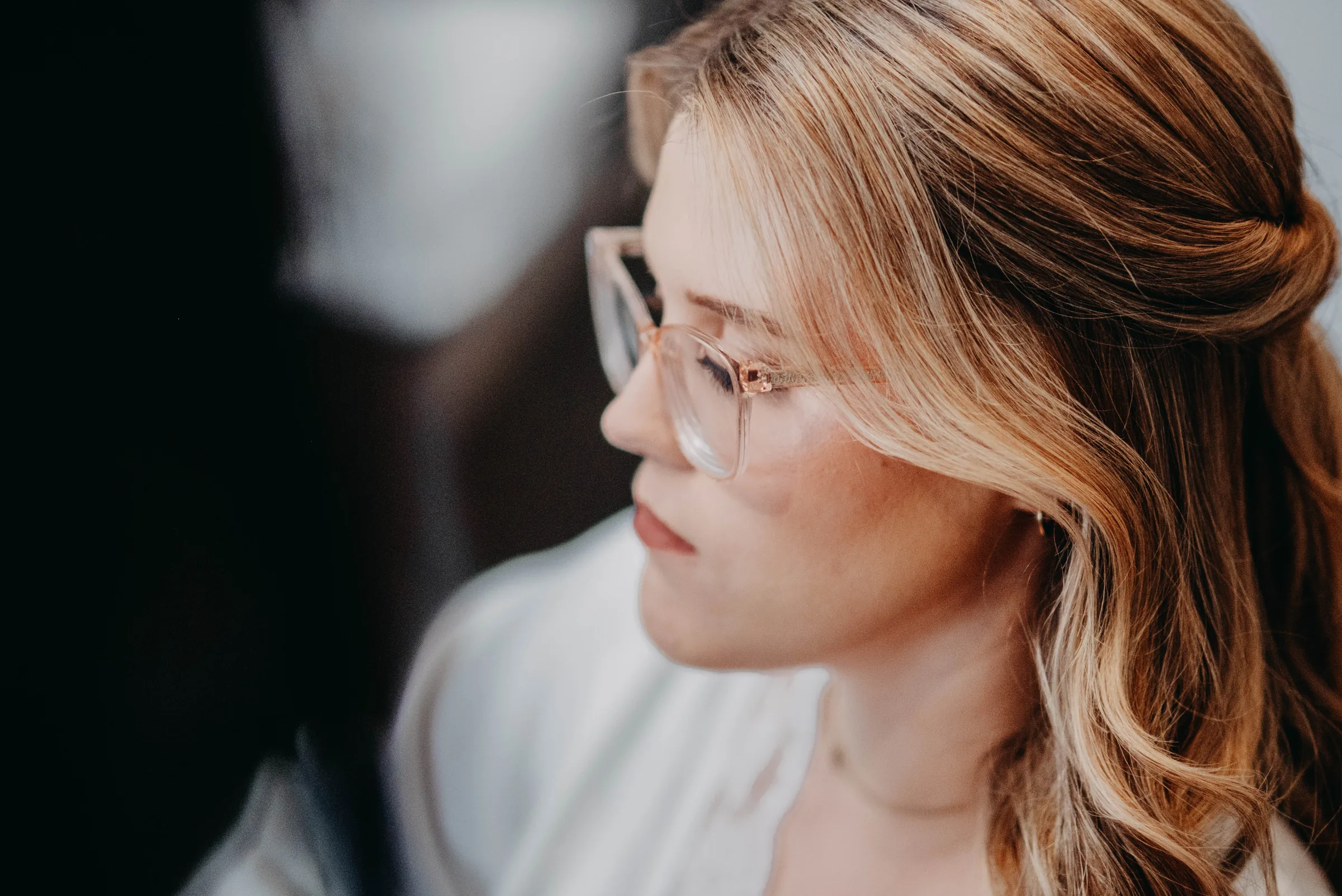 Close profile portrait of Kirra in her robe before getting into her wedding dress at The Vines Resort