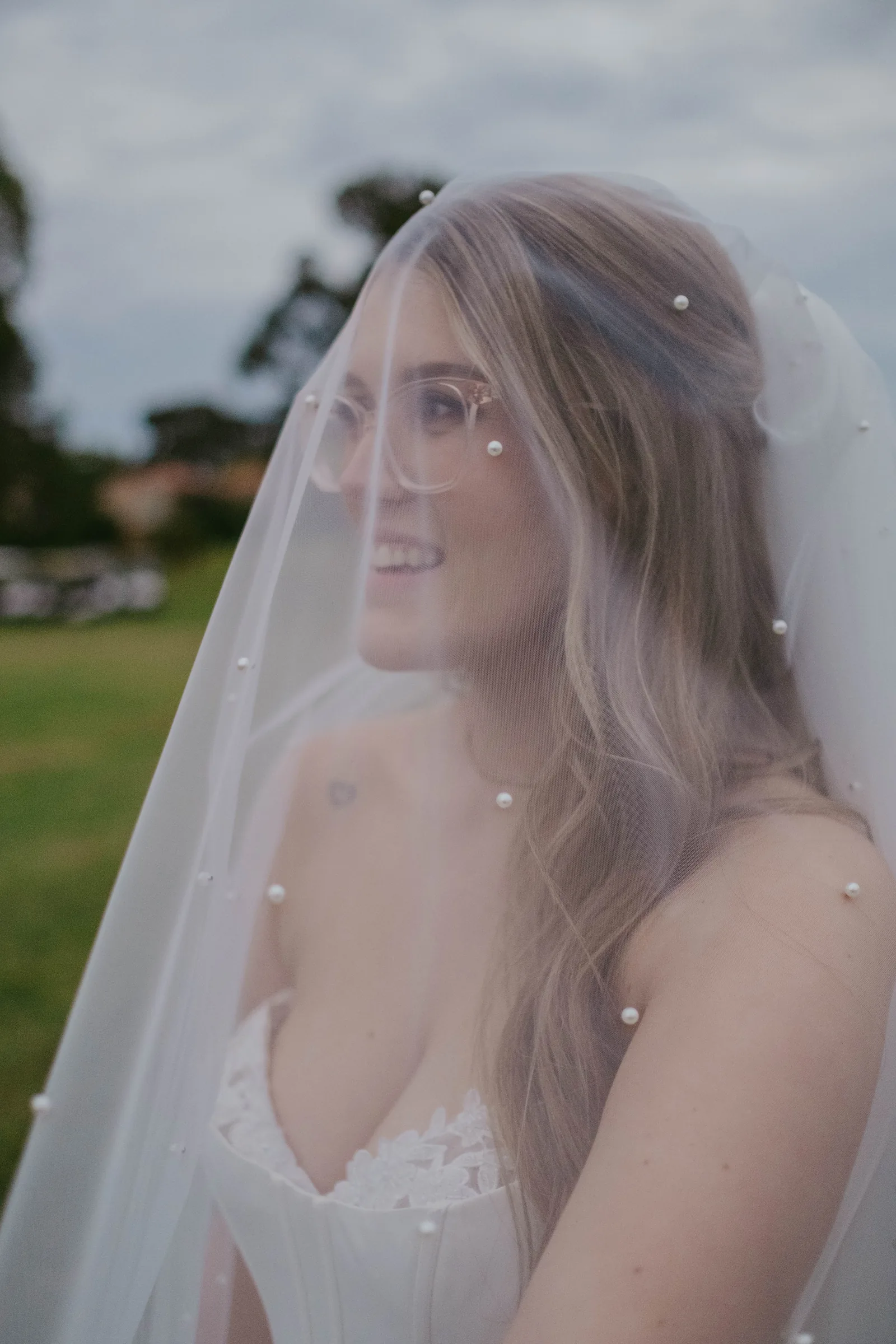 Close portrait of Kirra in her veil after her wedding ceremony at The Vines Resort