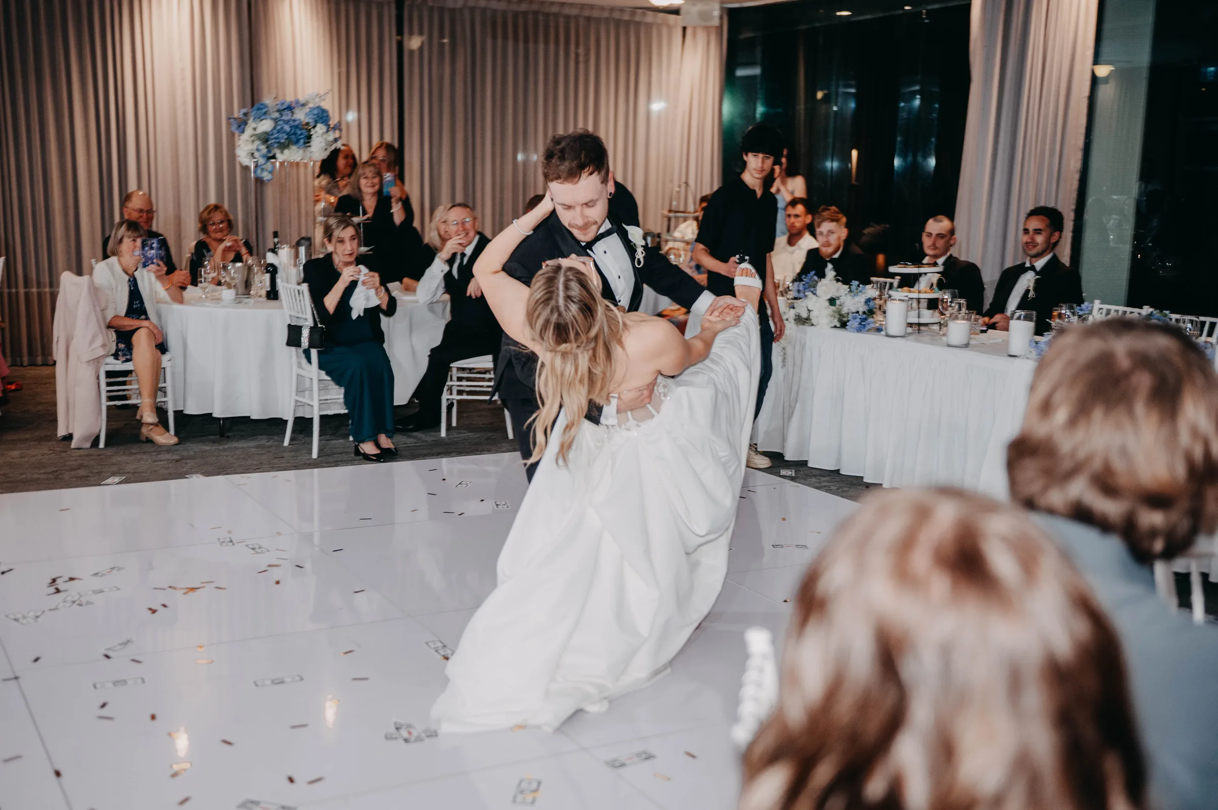 Guests dancing together on the dance floor at Kirra and Mitch's Vines Resort wedding reception