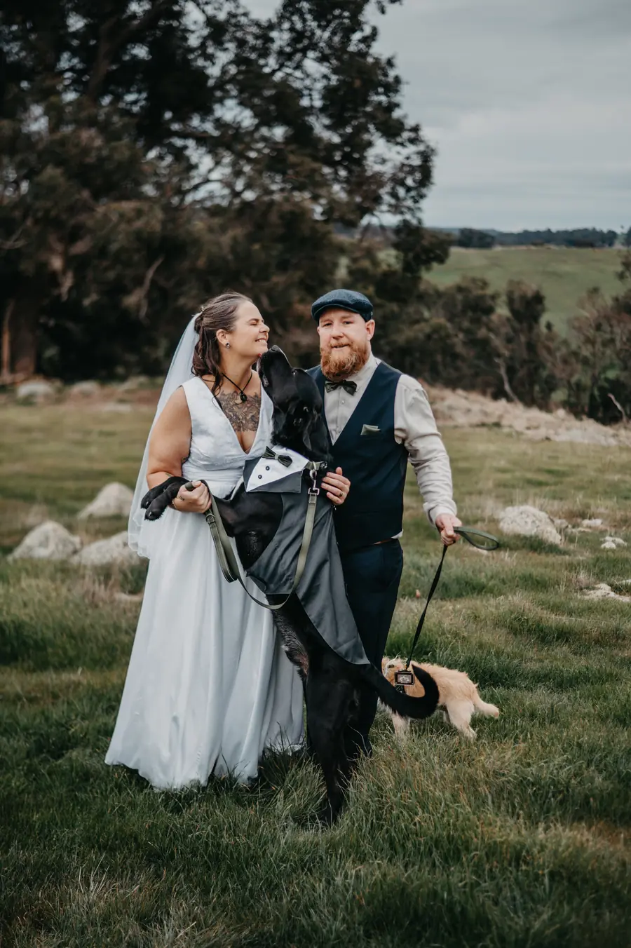 Liv and Ben with their dog dressed in a tiny tuxedo at Dalmore Farm
