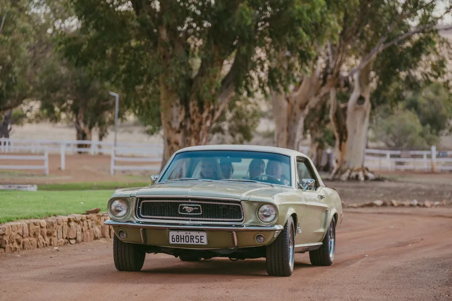 Detail of the vintage green muscle car used for Grace and Lachie's wedding at Buckland Estate