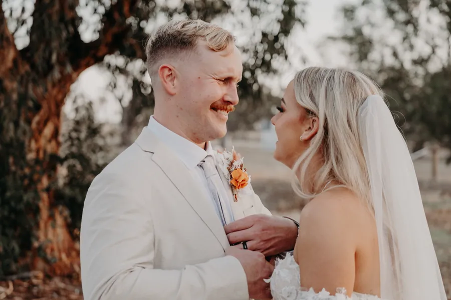 Close-up of Grace and Lachie foreheads together during golden hour portraits at Buckland Estate