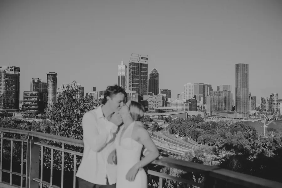 Close black and white portrait of Kayla and Brett at the Kings Park skyline lookout during their pre-wedding session