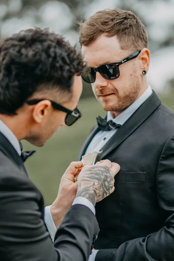 Close portrait of Mitch in sunglasses before his wedding at The Vines Resort