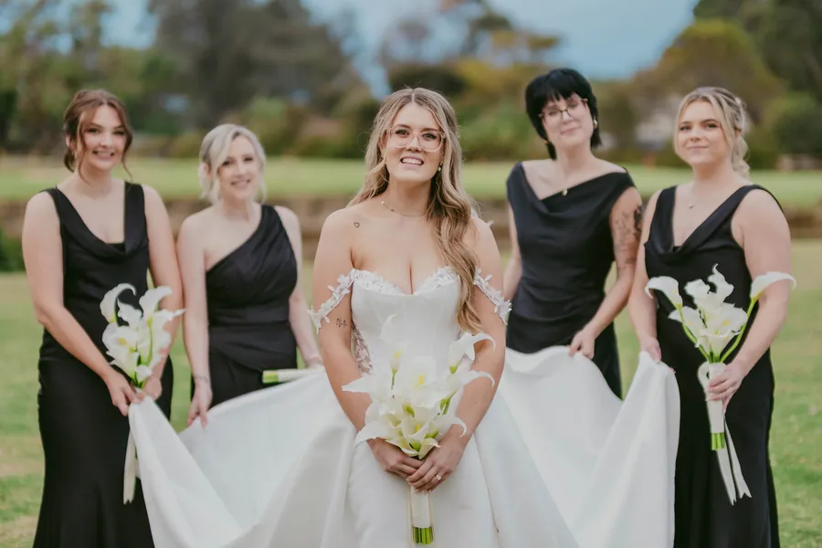 Full bridal party group portrait on the grounds of The Vines Resort