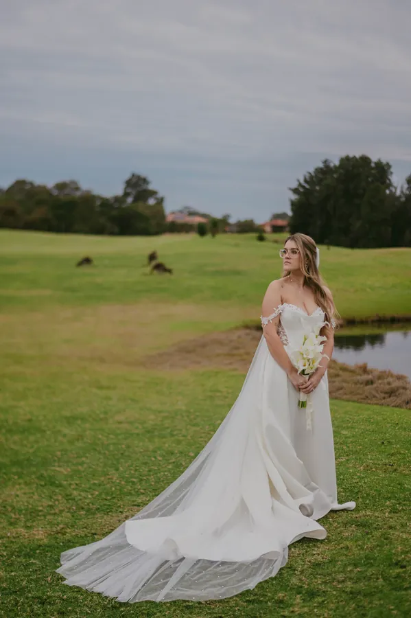 Kirra photographed alone on The Vines Resort grounds at dusk