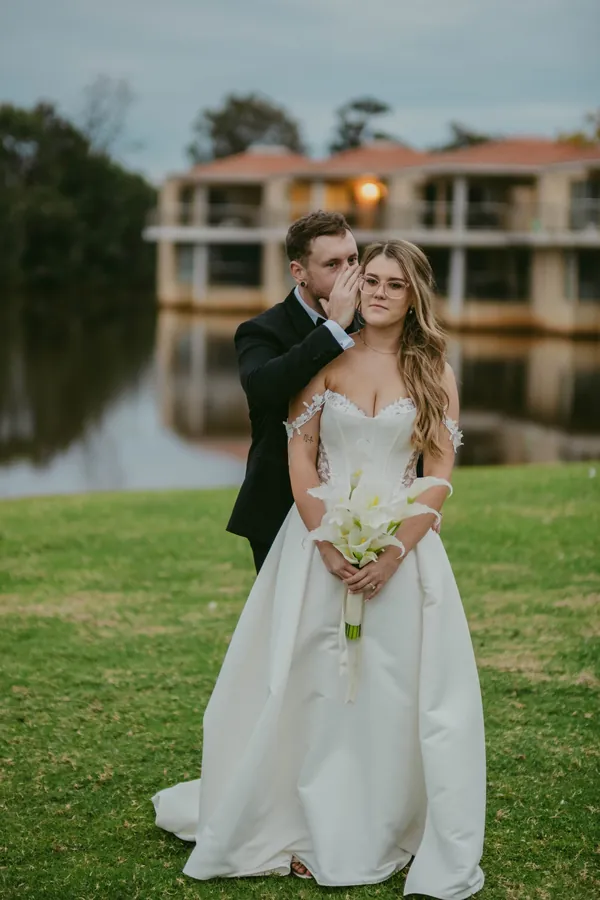 Kirra and Mitch close together in the evening light at The Vines Resort