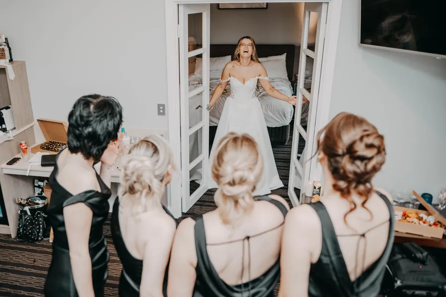 Bridesmaids having their hair styled together before Kirra and Mitch's Vines Resort wedding